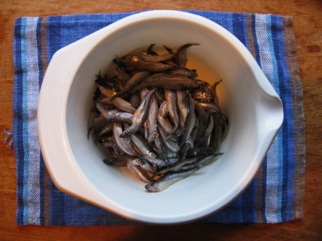 Smelts going into deep fryer.