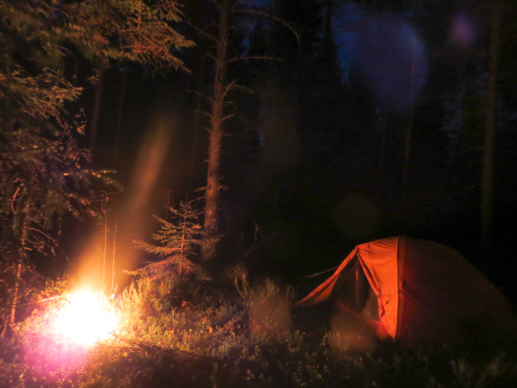 My lonely camp in the middle of night next to a camp fire