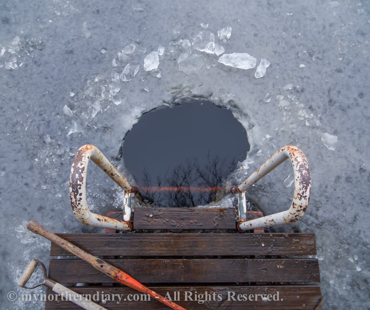 Ice swimming after making a hole